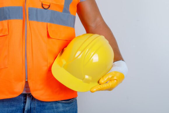 male-builder-uniform-jeans-gloves-holding-helmet-his-hand-front-view_176474-10062-e1601975951481